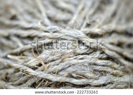 Close-up of an old frayed boat rope as a nautical background. Sepia