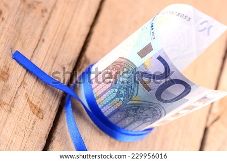 european money,  leading hard currencies Euro with blue ribbon