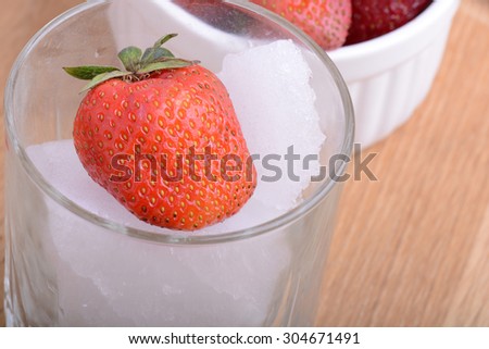 strawberry frozen in ice cube, health food concept