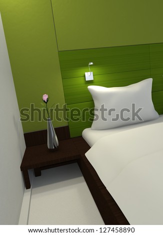 Interior of a modern minimalist green bedroom with a partial view of a bed and wooden headboard with an illuminated light mounted on it