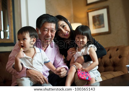 Attractive Asian Grand parents in Lounge