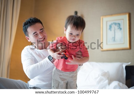 Asian dad with kid