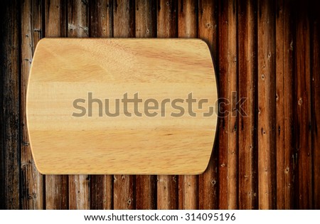 Empty cutting board on a wooden table.Top view