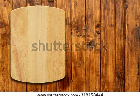 Empty cutting board on a wooden table.Top view
