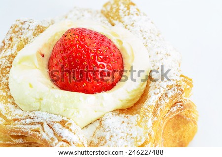 close up croissant top up with strawberry