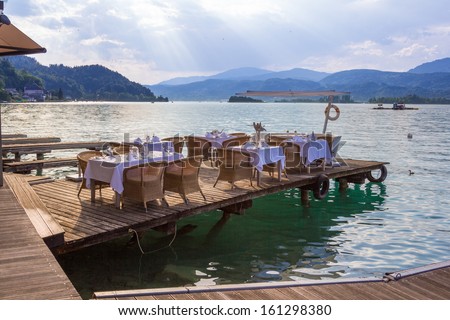 Luxurious restaurant with tables on pier at a Lake in Austria