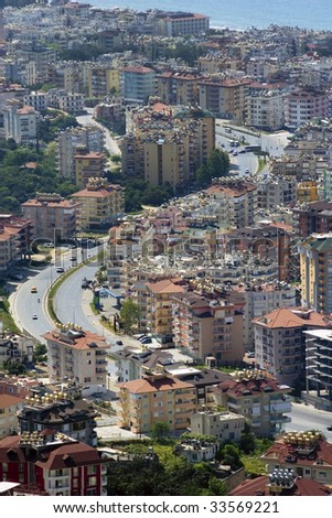 Modern and traditional apartment buildings of seaside town. Alanya, Turkey.