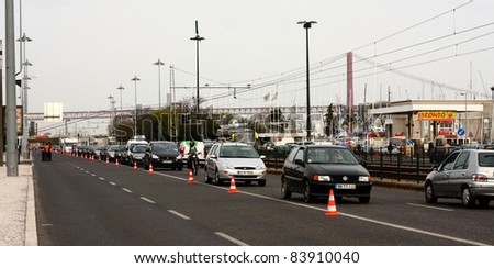 LISBON - MARCH 24: Cars line up as a result of traffic restrictions put in place for WRC Rally of Portugal, on March 24 2011, at India avenue in Lisbon, Portugal.