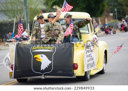 Mission Hills, CA - November 11, 2014: Unidentified veterans salutes at the The San Fernando Valley Veterans Day Parade