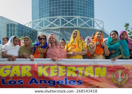 Los Angeles, CA, USA - April 5, 2015: Devotee Sikhs women marching at the Anniversary of Baisakhi celebration.