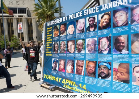 Los Angeles, CA, USA - April 14, 2015:  Man next to banner  during Stop Murder by Police.
