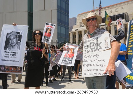 Los Angeles, CA, USA - April 14, 2015:  People holding signs during Stop Murder by Police.