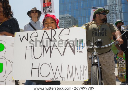 Los Angeles, CA, USA - April 14, 2015:  Child holding sign  during Stop Murder by Police.