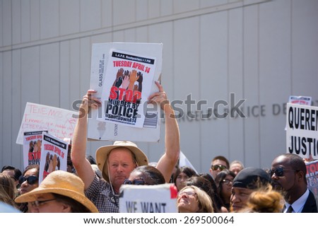 Los Angeles, CA, USA - April 14, 2015:  People raising signs in front of Los Angeles Police Department during Stop Murder by Police.
