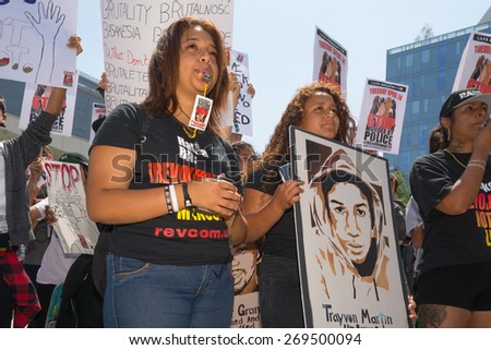 Los Angeles, CA, USA - April 14, 2015:  Women blowing whistles during Stop Murder by Police.