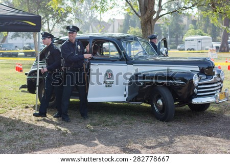 Woodland Hills, CA, USA - May 30, 2015: Vintage Ford police car on display during 12th Annual LAPD Car Show & Safety Fair.