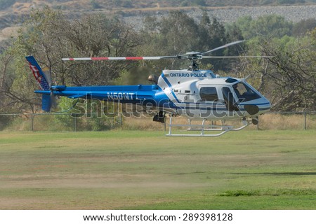 Lakeview Terrace, CA, USA - June 20, 2015: Ontario Police helicopter during Los Angeles American Heroes Air Show, event designed to educate the public about rotary-wing aviation.