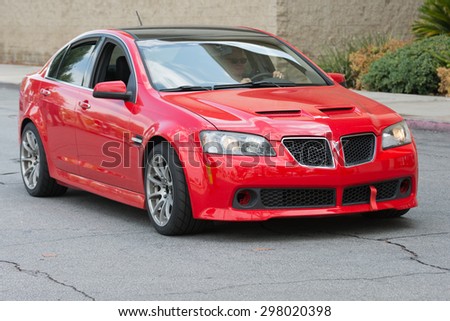 Woodland Hills, CA, USA - July 19, 2015:  Red Pontiac G8 car on display at the Supercar Sunday car event.