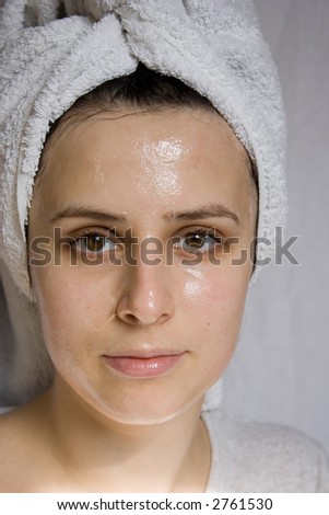 Portrait of young woman with beauty mask