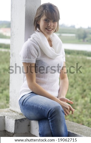 beautiful girl wearing white polo-necked sweater