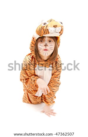 little girl wearing tiger costume isolated on white