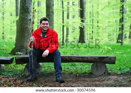 Resting man in a beech forest