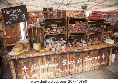 BOURG SAINT MAURICE, FRANCE, 26 JULY 2014: ham and sausages on a market in Bourg st Maurice in the french haute savoie region