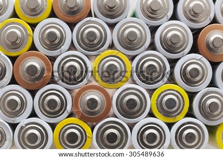 picture with large amount of used AA batteries in several colors