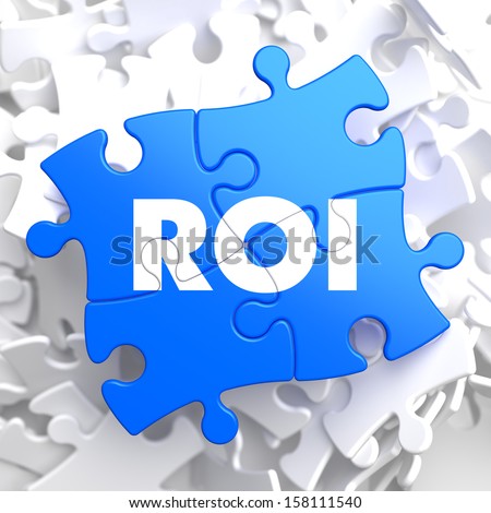 ROI - Return Of Investment - Written on Blue Puzzle Pieces. Business Concept.