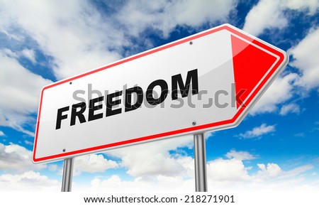 Freedom- Inscription on Red Road Sign on Sky Background.