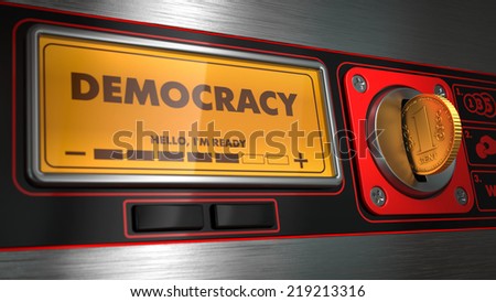 Democracy - Inscription on Display of Red Vending Machine. Political Concept.