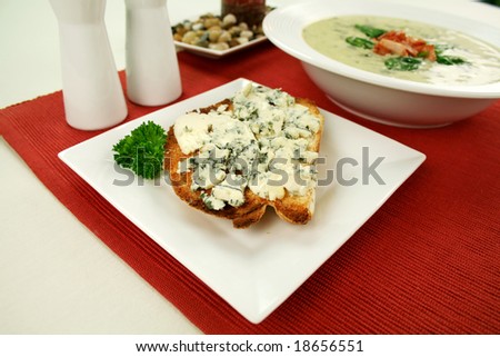 Creamy spinach soup with crispy bacon and blue cheese toast.