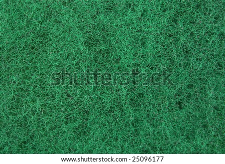 Tight green textured mesh background giving a grass like appearance.