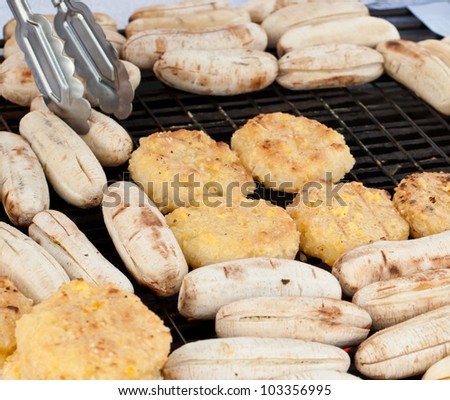 grilling bananas and whole rice made into balls, thai street food