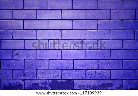 purple brick wall getting older from the bottom