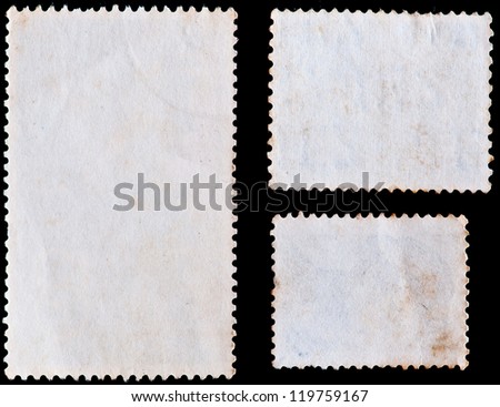 blank postage stamps isolated on black