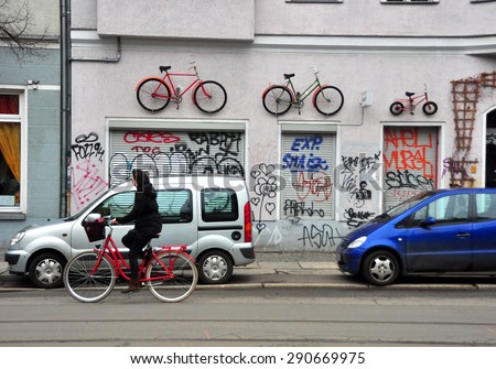 BERLIN MARCH 6: Unidentified female riding the bicycle (over 15% people in Berlin prefer moving by bike) on March 6, 2015.