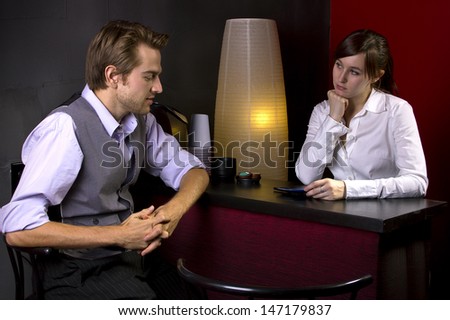 young businessman ordering coffee from female waitress