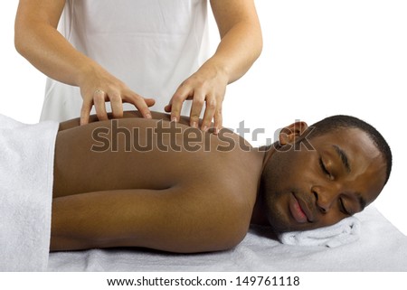 young female therapist examining male patient\'s spinal column