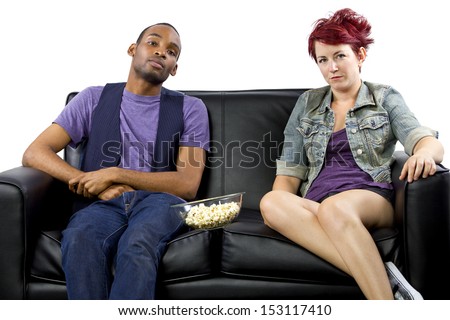 multi-racial male and female roommates sharing a couch