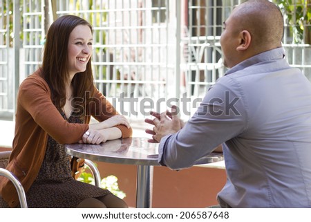 interracial couple meeting on a casual first date outdoors