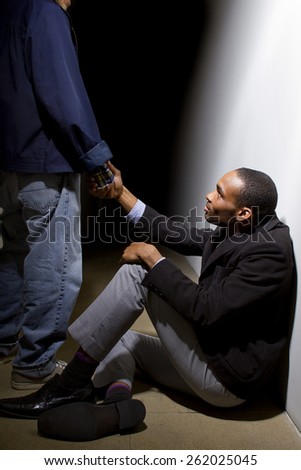 man helping a depressed fellow by offering a helping hand