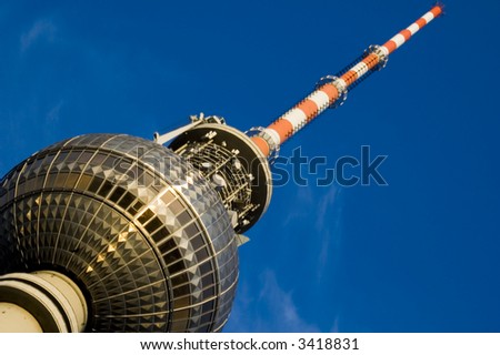 A close up angle on the TV tower Berlin shot on a summers evening just before the sun goes down