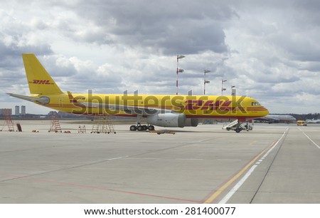 MOSCOW, RUSSIA - APRIL 15, 2015: Cargo aircraft TU-204S transport company DHL in the Parking lot of the airport Sheremetyevo