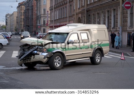 SAINT-PETERSBURG, RUSSIA - SEPTEMBER 17, 2012: Broken collector armored car on the roadway
