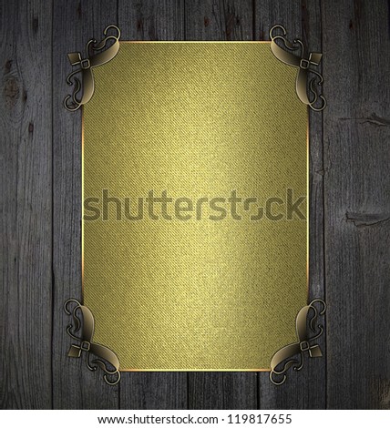 Template for writing. Wooden background with gold nameplate and gold ornament edges