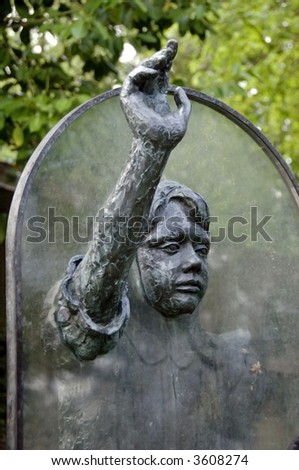Statue depicting Alice through the looking glass in public park, Guildford, Surrey, Great Britain