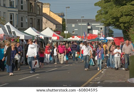 BALLYCASTLE, N. IRELAND - AUGUST 31: People browse among the crowded traditional market stalls at the famous annual Ould Lammas Fair on August 31, 2010 in Ballycastle, N. Ireland.
