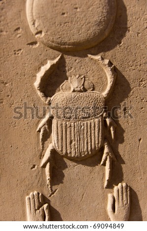 bas-relief of scarab beetle on the wall of ancient egyptian temple, Luxor, Karnak Temple