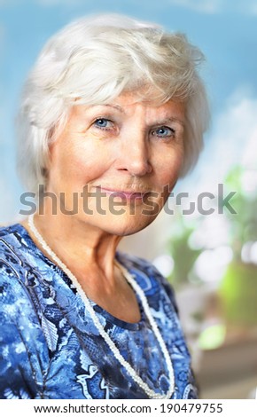 Senior lady looking relaxed at camera